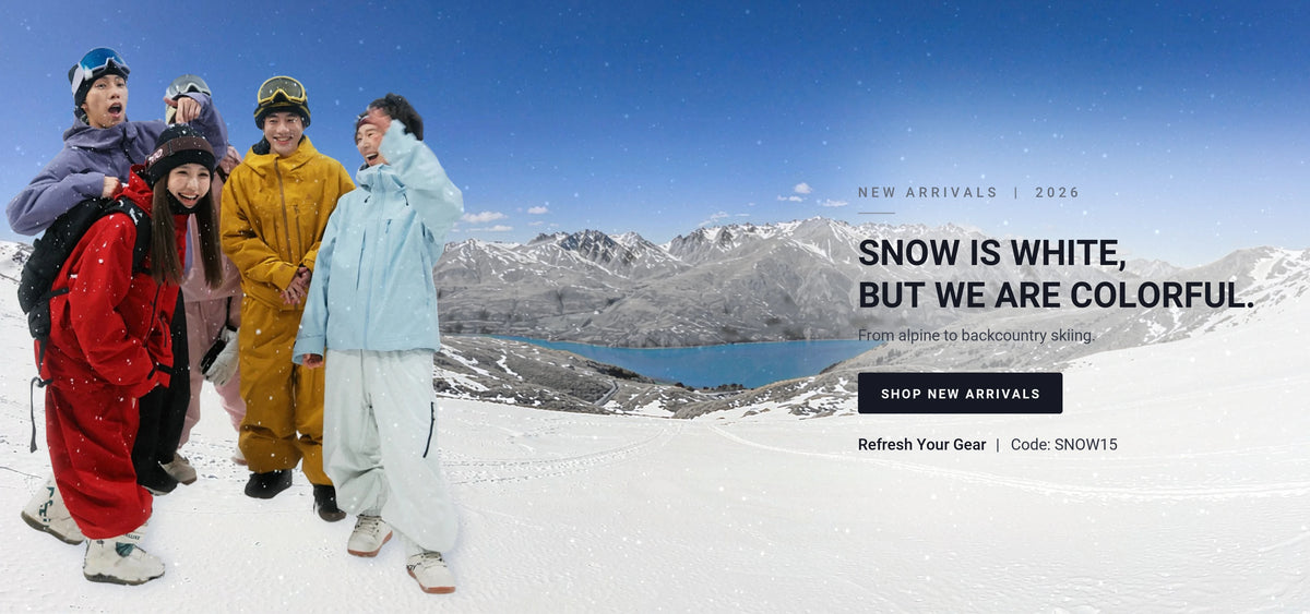 Group of skiers wearing colorful NANEND ski suits and jackets in a snowy mountain landscape, showcasing the 2026 new arrivals collection
